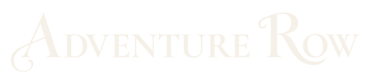 The words 'ADVENTURE ROW' in a light beige serif typeface, presented on a solid white background.